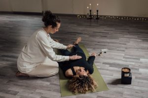 Prepare for reiki — A serene indoor setting capturing a therapist using Reiki techniques on a client.