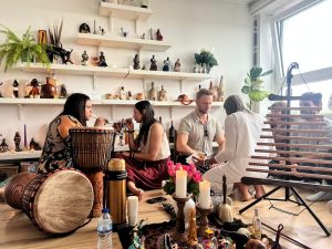Hape being shared at a cacao ceremony, with drums, candles and a ceremonial altar